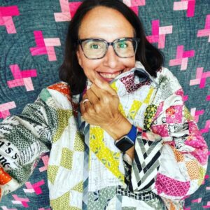 Cheeky Lorena wrapped in a quilt coat